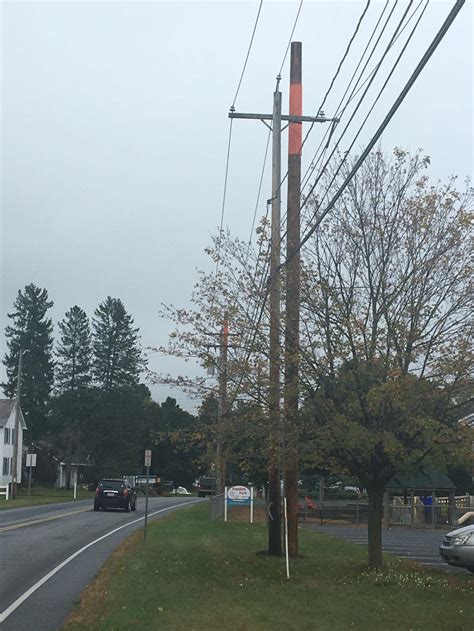Town debates relocating telephone poles to avoid witch collisions